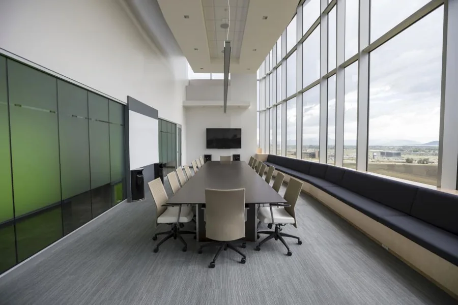 A bright, clean modern office with a meeting table